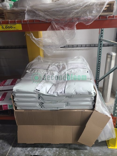 Box of 46 bags of Bowery 6-11-30 water-soluble fertilizer for controlled environment agriculture on industrial shelving