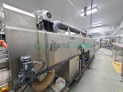 LIMEX industrial tunnel washer installed in food processing facility showing drive motors and utility connections