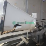 Wide view of LIMEX industrial tunnel washer showing complete installation with ventilation system in food facility