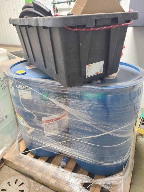 Wrapped Ecolab Oxonia Active sanitizer drums on pallet with HDX storage tote showing proper storage for controlled environment agriculture sanitizers