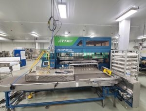 TTA PackPlanter commercial greenhouse transplanting system with conveyor belt and control panel