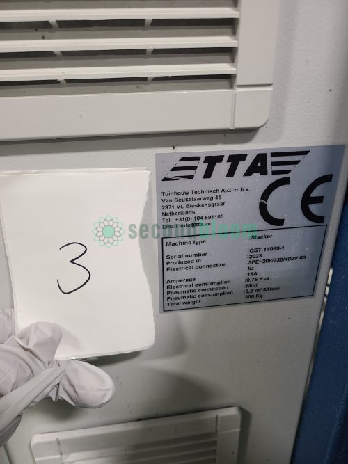 TTA Stacker specification plate showing model OST-14089-1 serial number and technical details