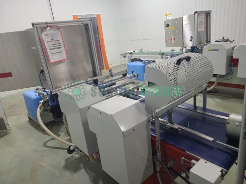 AgriNomix automated seeding system with perforated drum, control panel, and blue filtration tanks