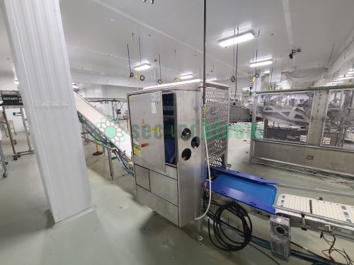 Roopack branded filling equipment with stainless steel perforated panels and conveyor system in food processing facility
