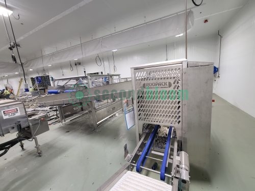Roopack filling equipment with control panel, conveyor belt system, and access door in vertical farming facility