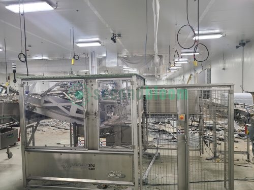 Viscon/Roopack automated harvesting system with stainless steel safety enclosure and wire mesh guarding in food processing facility