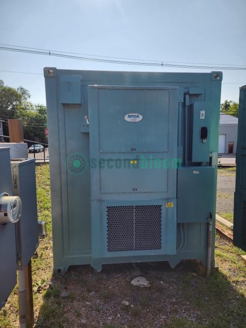 Unpainted turquoise rear panel of Freight Farms container showing ventilation unit, electrical panels, and technical equipment mounting