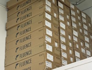 Stacked Fluence RAPTR 1000 boxes in warehouse