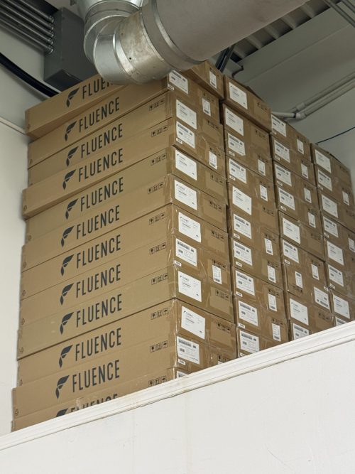 Stacked Fluence RAPTR 1000 boxes in warehouse