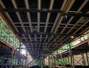 Under-rack view showing SPYDR 2h47 lights in a large facility