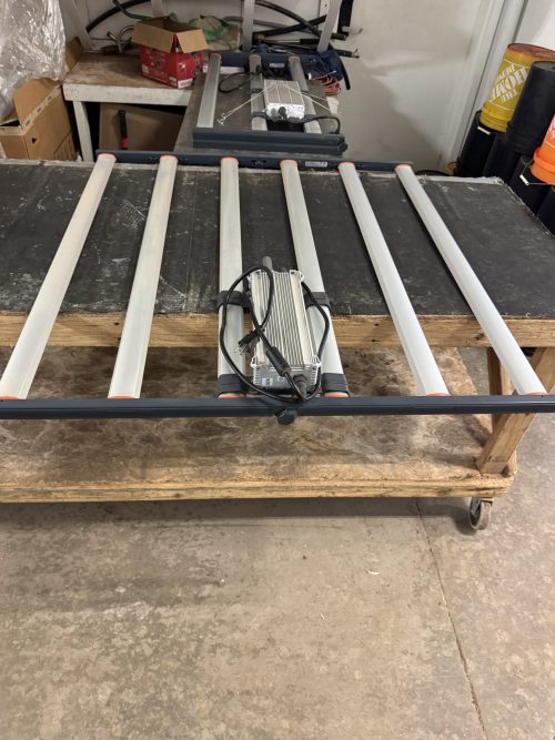 Top view of Fluence SPYDR 2i 47 LED grow light on workbench