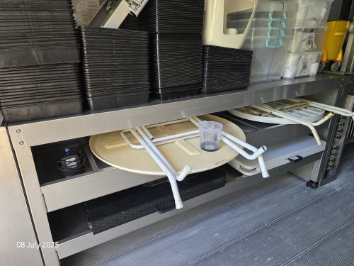 Freight Farms container workspace showing stainless steel surfaces, growing trays, and controlled environment agriculture equipment for vertical farming