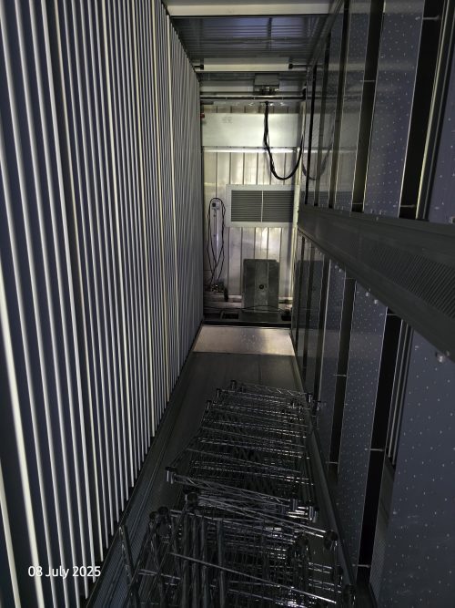 Vertical farming container interior with multi-tier LED growing racks, controlled environment agriculture systems, and automated growing infrastructure