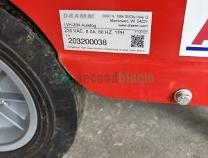 Close-up view of Dramm AutoFog equipment serial number label showing model LVH-15NS specifications